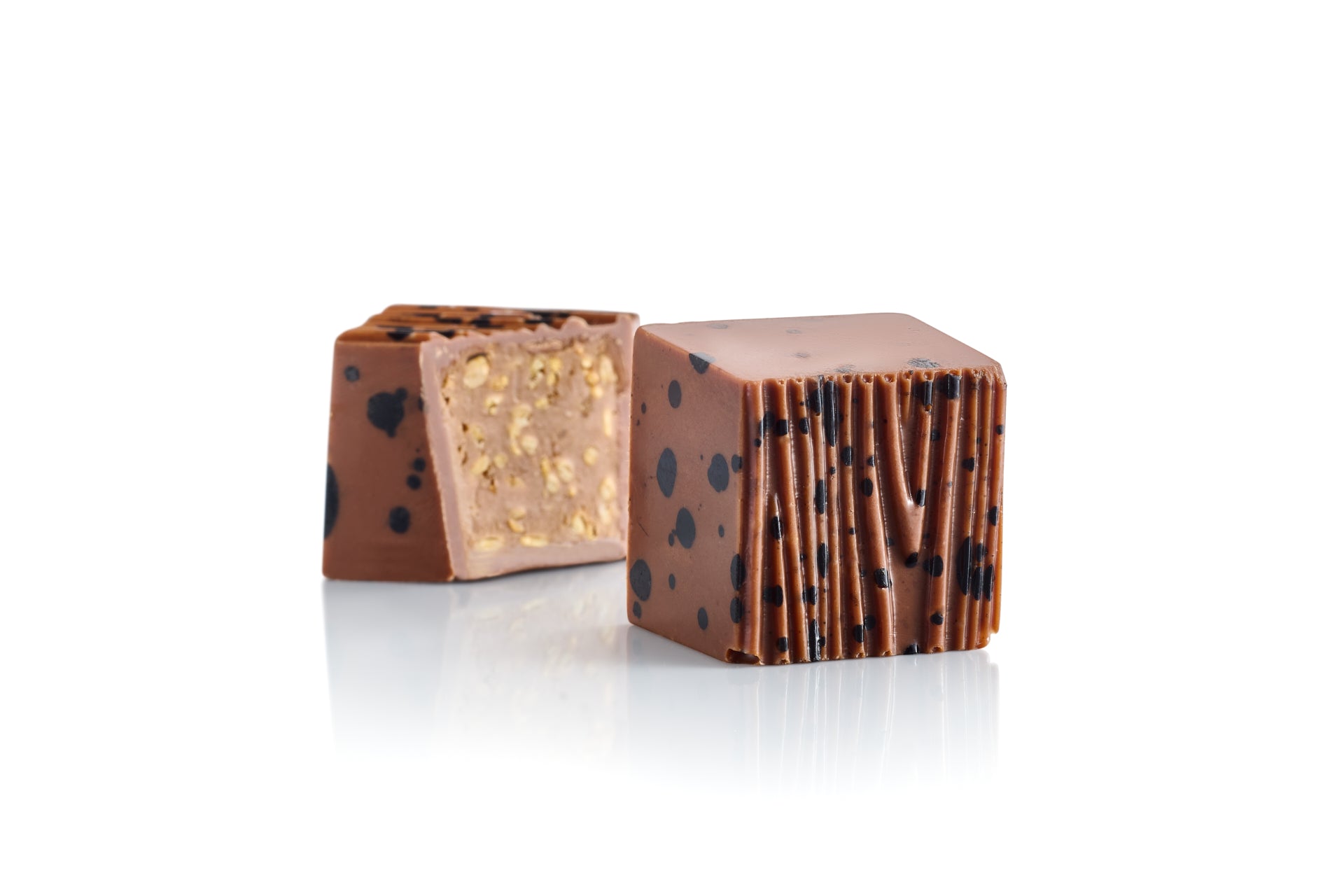 Les bonbons chocolate bonbons, milk chocolate with tahini or sesame