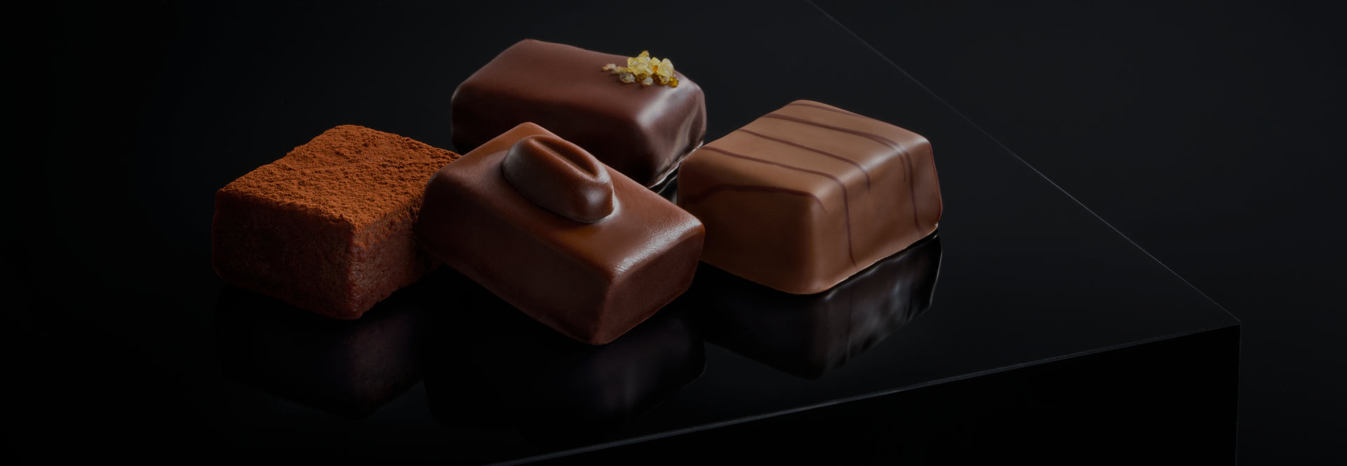 LES BONBONS Chocolate bonbons, milk chocolate, dark chocolate, assorted chocolate, creative shot, high quality belgian chocolate, close up dark